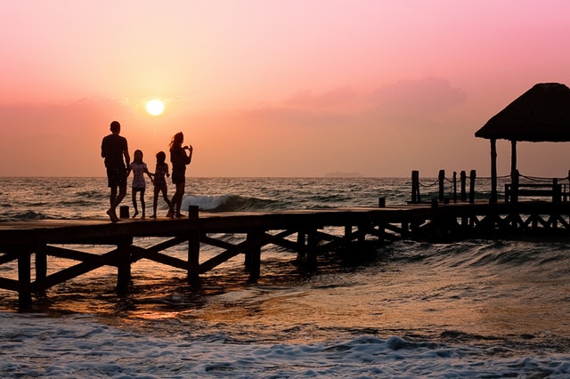 Family stood on pier